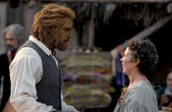 Alexander Skarsgard as Wicker Husband and Olivia Colman as Fisherwoman on the set of their film Wicker about to dance.